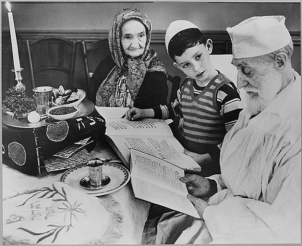 Photograph of a Young Jewish Boy with Elders at a Passover Ceremony, 04/16/1951